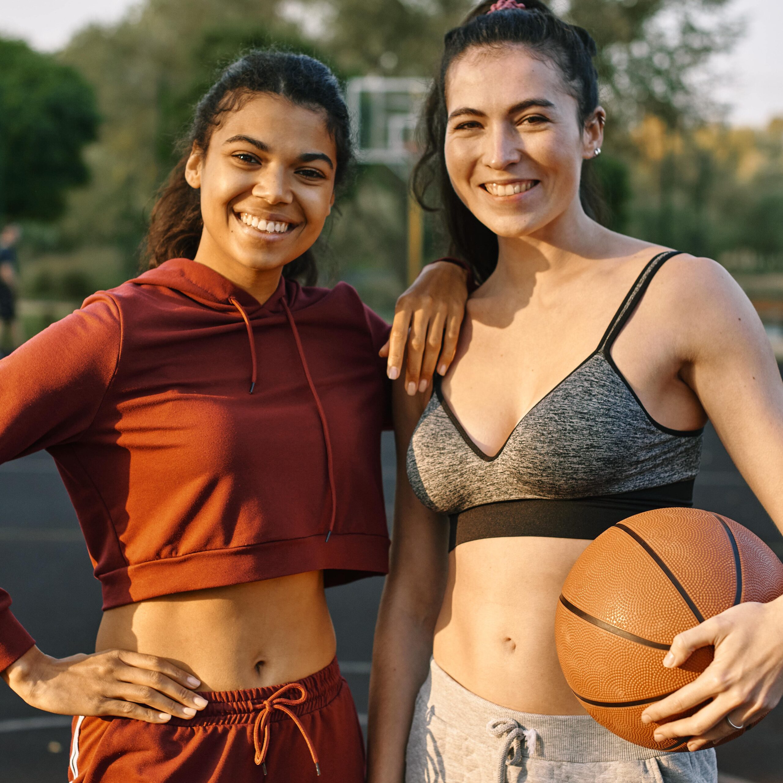 young-women-posing-with-basketball-min